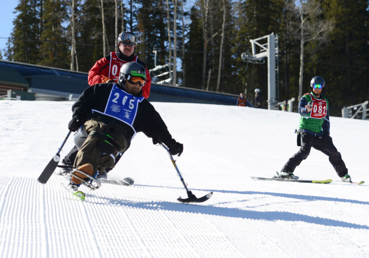 \"Up there, I'm no different from anybody. No PTSD. I'm at my happiest,\" said Carlos Figueroa of the feeling of carving down slopes.