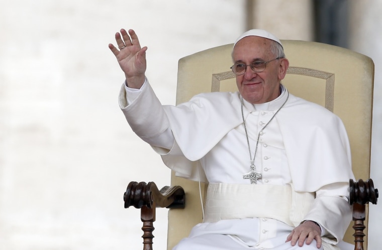 Pope Francis waves as he leads the weekly general audience in Saint Peter's Square, at the Vatican on April 3.