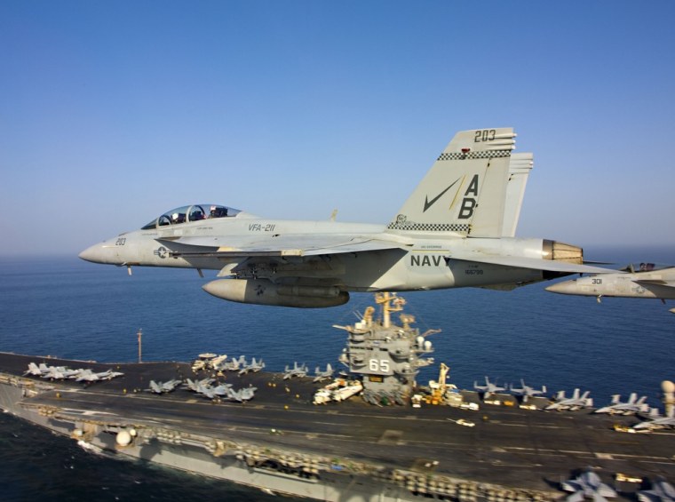 Two F/A-18 Super Hornets, like the one that crashed Monday, are shown flying above the aircraft carrier USS Enterprise in October 2012.
