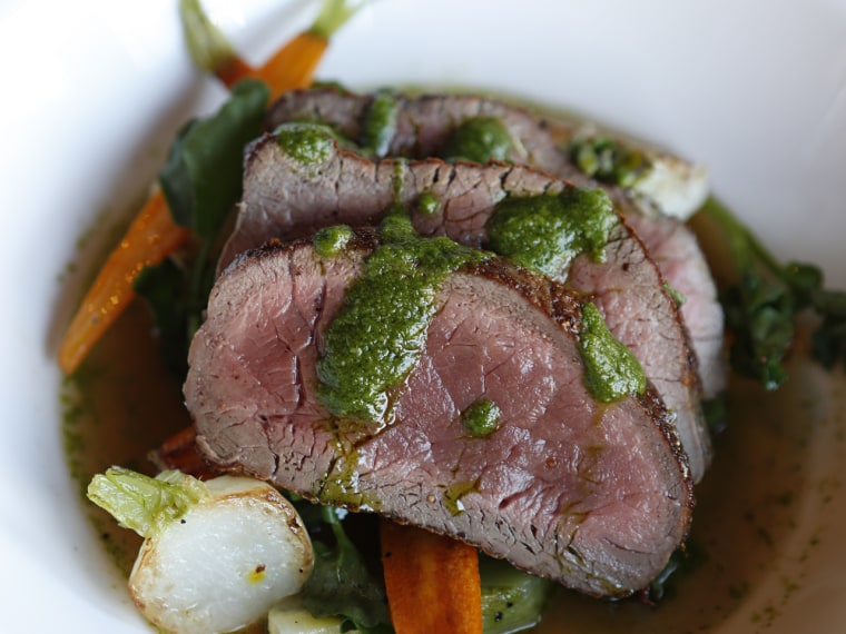 Rendell's pan-roasted venison is prepared in a Scotch broth with baby vegetables and parsley sauce.
