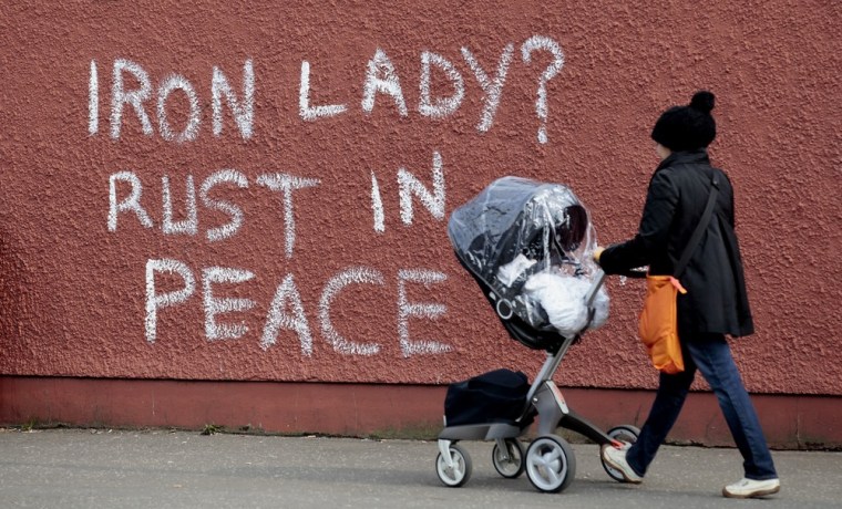 Anti-Margaret Thatcher graffiti adorns a wall on the Falls Road in west Belfast, Northern Ireland, Tuesday,