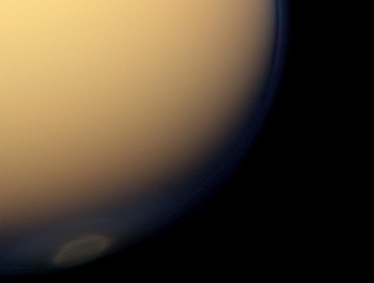 The recently formed south polar vortex stands out in the color-swaddled atmosphere of Saturn's largest moon, Titan, in this natural color view from NASA's Cassini spacecraft.