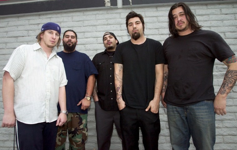 Chi Cheng, right, -- seen with his fellow Deftones (left to right) drummer Abe Cunningham, guitarist Stephen Carpenter, keyboardist Frank Delgado and singer Chino Moreno -- died after a four-year coma following a car accident.