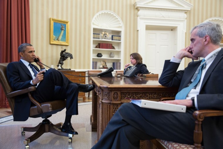 In this handout provided by the White House, President Barack Obama talks on the phone with FBI Director Robert Mueller to receive an update on the explosions that occurred in Boston on April 15, 2013.