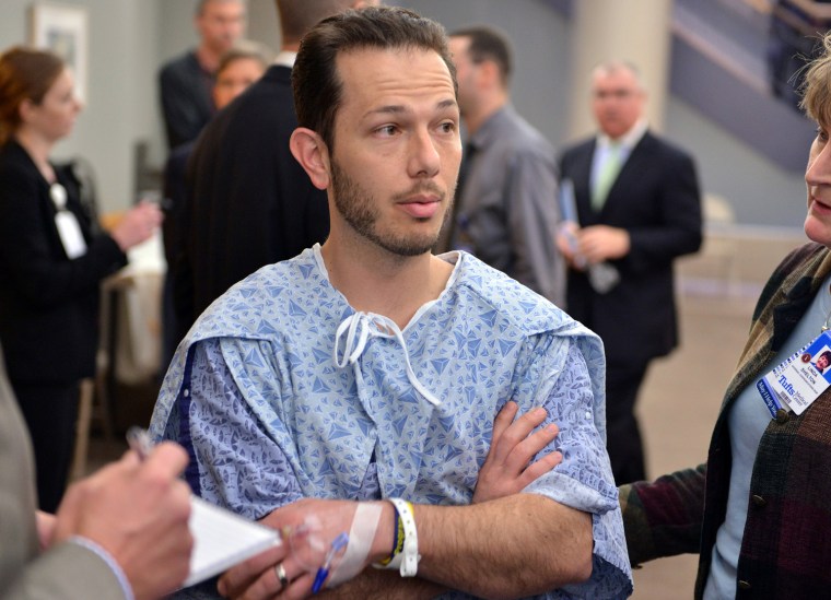 Nicholas Yanni, 32, of Boston, speaks to reporters at Tufts Medical Center in Boston. He and his wife, Lee Ann Yanni, 31, were injured in the Boston Marathon bombing.
