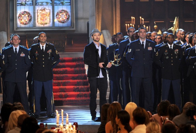 Actor Justin Timberlake is surrounded by service members as he accepts the award for Entertainer of the Year osntage during Spike TV's 6th Annual \"Guys Choice Awards\" in Culver City, Calif., on June 2.