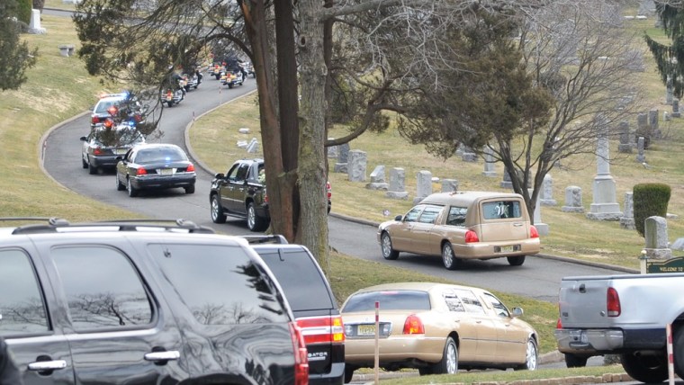 The hearse carrying the body of Whitney Houston arrives for her private burial at the Fairview Cemetery on Sunday in Westfield, N.J.