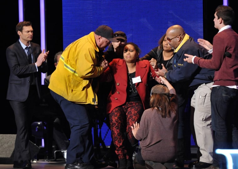 Imani Handy is helped off the stage after fainting during her performance.