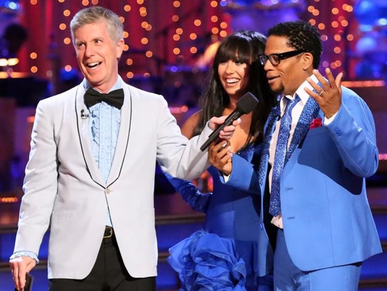 D.L. Hughley, right, with pro partner Cheryl Burke and host Tom Bergeron, on \"Dancing With the Stars.\"