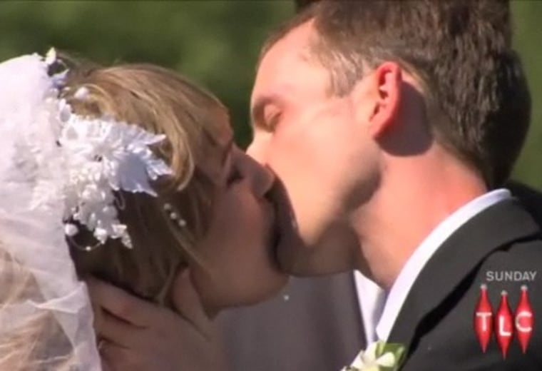 Shanna and Ryan share their first kiss, at their wedding.