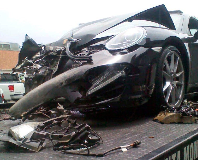 Lindsay's car lies on a flatbed tow truck after it collided with an 18-wheeler on Friday.