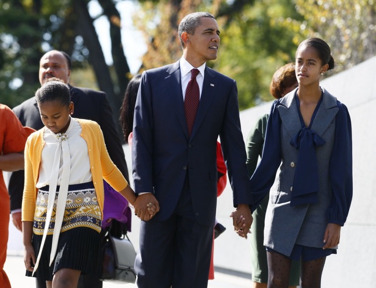 President Obama walks with daughters Sasha, left, and Malia, at the Martin Luther King Jr. Memorial in Washington on Sunday.