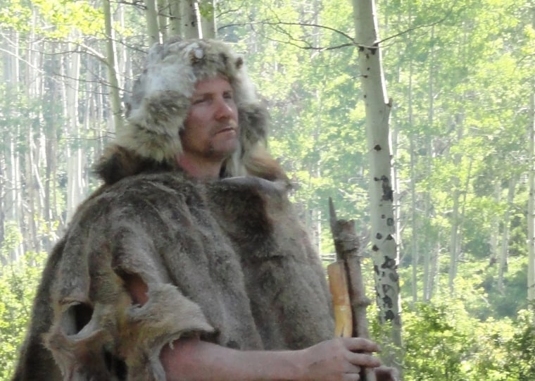 Morgan Spurlock, fully dressed in caveman gear, on Discovery's \"Curiosity: I, Caveman.\"