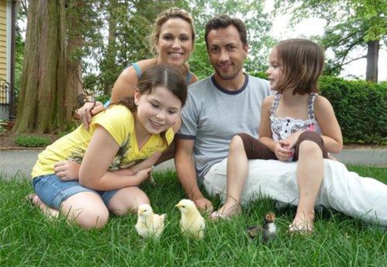 Amy Robach enjoys some family time on a sunny day. Look close and you'll even see a few baby chicks joining in on all the fun!