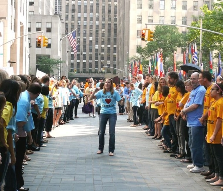 People lined up in fantastic t-shirts to welcome Meredith onto the Plaza.