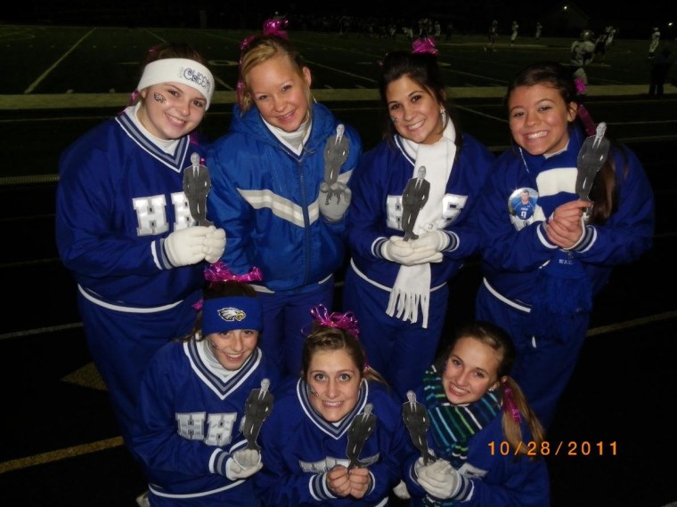 Cheeleaders from Hubbard, Ohio, pose with their Flat Matt-scots at the last Friday night football game of the season.