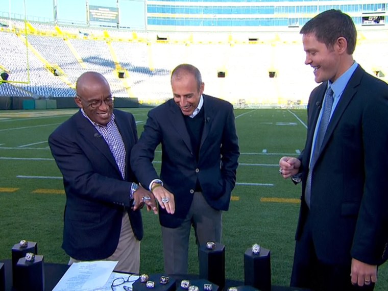 Al, Matt and Jostens President and CEO Tim Larson get dazzled by the bling.