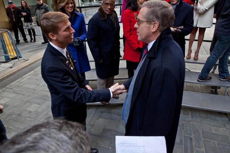 Brian Williams greets Jack McBrayer, who plays a super NBC page on \"30 Rock.\"