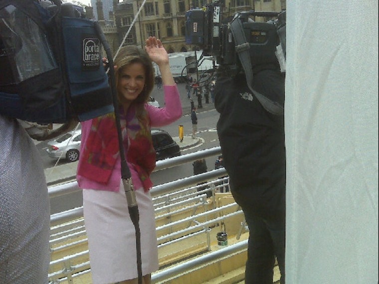 A busy day at Westminster Abbey as Natalie Morales gets caught in a throng of cameras.