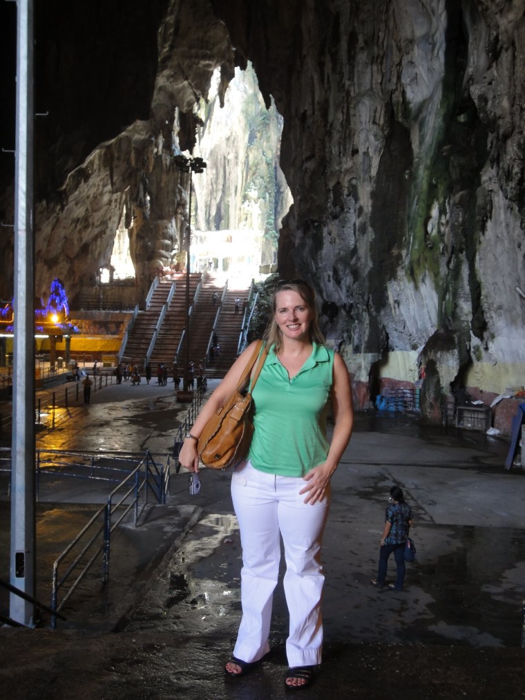 Producer Karen Trosset stands inside the Batu Caves.