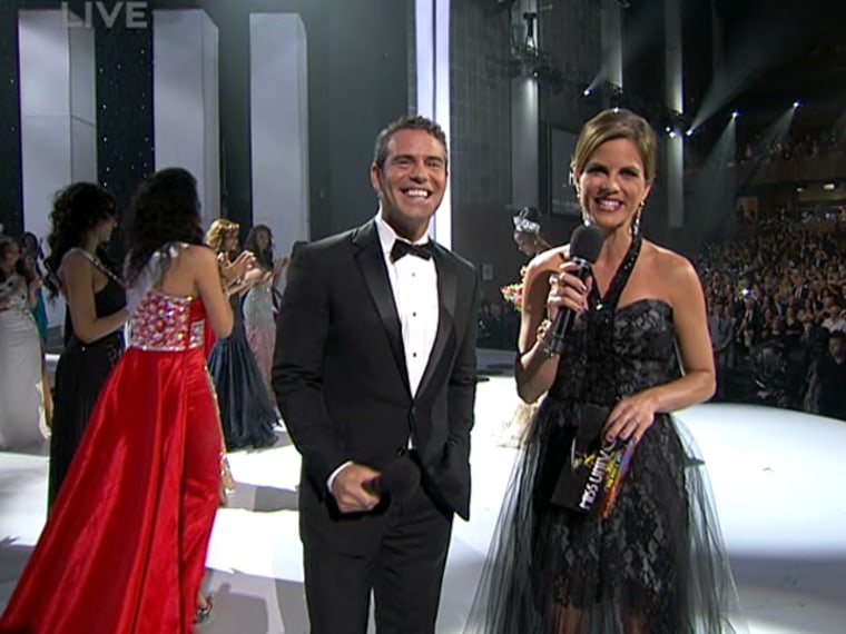 TODAY's Natalie Morales stands with fellow Miss Universe co-host Andy Cohen, from Bravo.