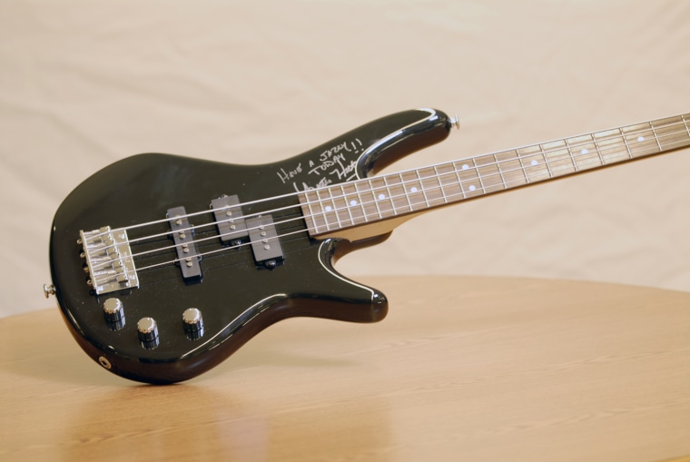 Lester Holt donated this autographed bass guitar.