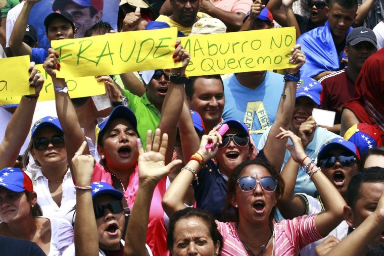 Supporters of opposition leader Henrique Capriles take part in a demonstration in Maracaibo on Tuesday to demand a recount of the votes in Sunday's election.