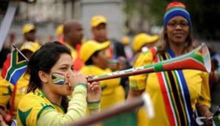 South African football fans blow vuvuzela horns for the opening ceremony of the FIFA World Cup 2010,