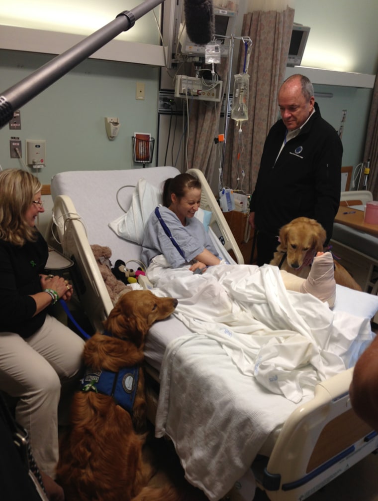 Image: Lee Ann Yanni with comfort dogs in hospital
