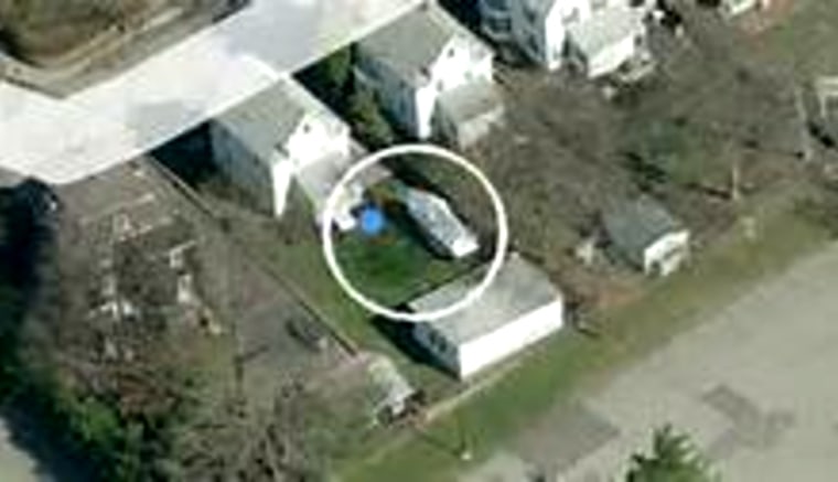 Aerial image of the boat in the backyard of the house in Watertown, Mass., where Dzhokhar Tsarnaev was hiding.