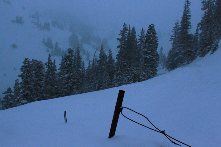 Snow falls near the spot where five members of a backcountry snowboarder group were found dead after they were trapped by an avalanche on Loveland Pass, Colo., Saturday, April 20, 2013.