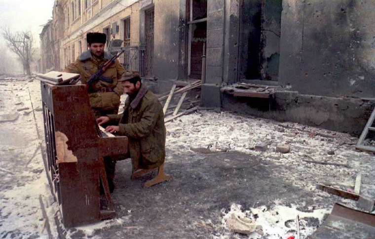 Chechen volunteer checks a piano 27 December in one of the main streets of Grozny, where Russian jets have conducted bomb attacks over the past several days.