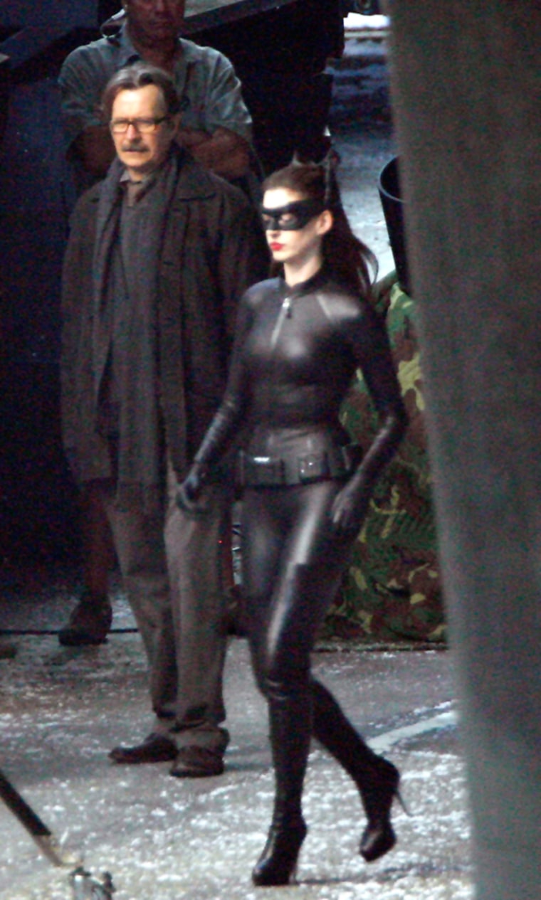 Anne Hathaway and Gary Oldman are seen on the set of the next Batman film.