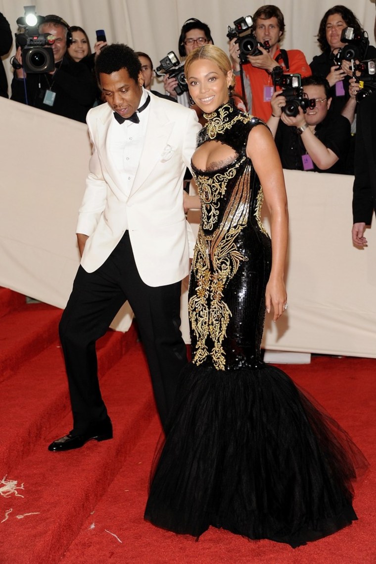 That first step is a doozy ... Beyonce and her husband Jay-Z arrive at the Metropolitan Museum of Art Costume Institute gala in New York on Monday.