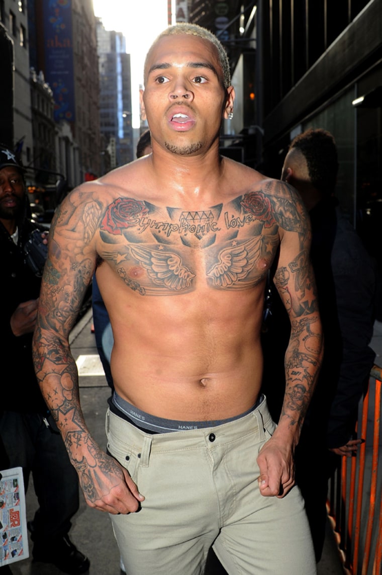Chris Brown is seen shirtless in Times Square after his \"Good Morning America\" appearance on Tuesday.