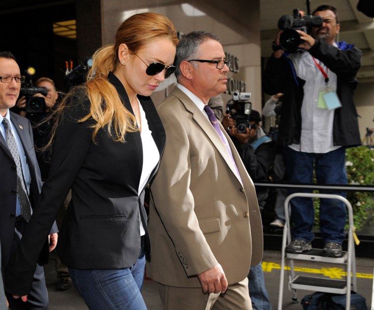 Lindsay Lohan exits a probation violation hearing at Beverly Hills Courthouse in Beverly Hills, Calif., on Friday.