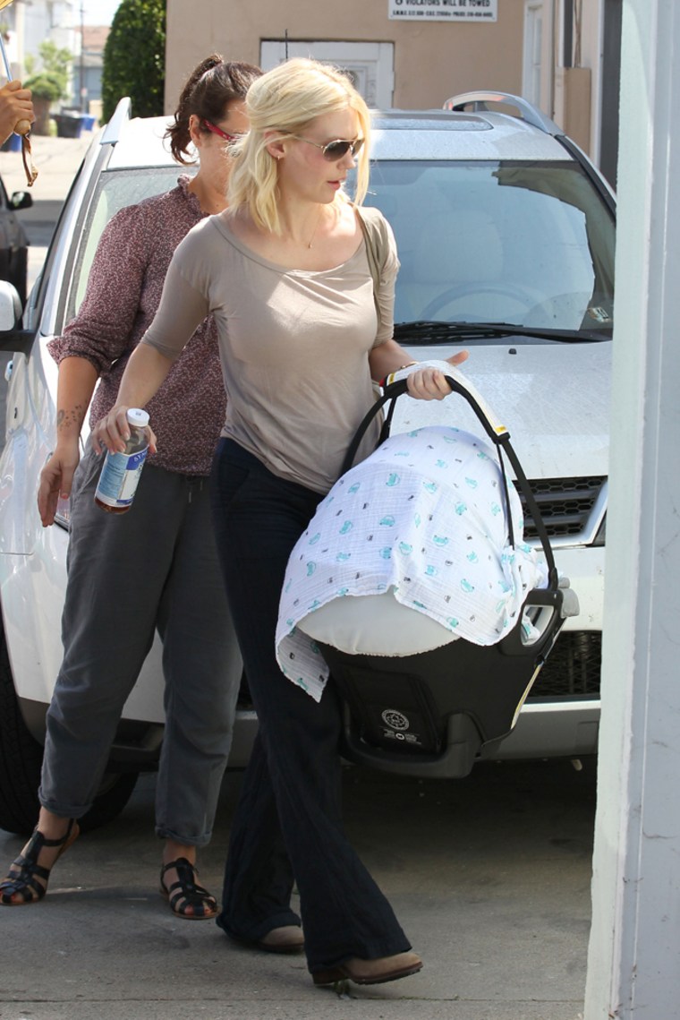 January Jones brings her 2-week-old baby boy Xander Dane to a friend's house in Santa Monica, Calif.