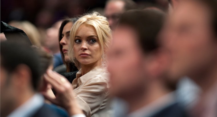 Actress Lindsay Lohan looks around the crowd as she watches the New York Knicks play the Memphis Grizzlies at Madison Square Garden in New York on Thursday.