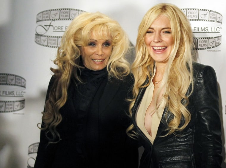 Lindsay Lohan, right, poses with Victoria Gotti after a news conference to promote the film \"Gotti:Three Generations\" in New York on April 12.