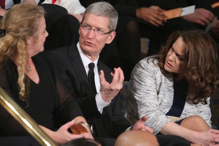 Apple CEO Tim Cook (C) attends President Barack Obama's State of the Union address February 12, 2013 in Washington, DC. As Apple's stock slumps, talk ...