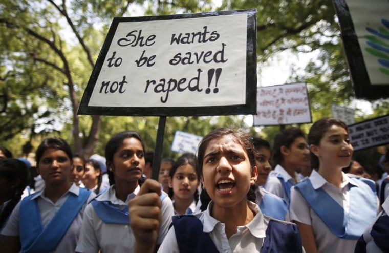 Indian students shout slogans as they hold placards demanding stringent punishment to rapists during a protest in New Delhi, on April, 23.