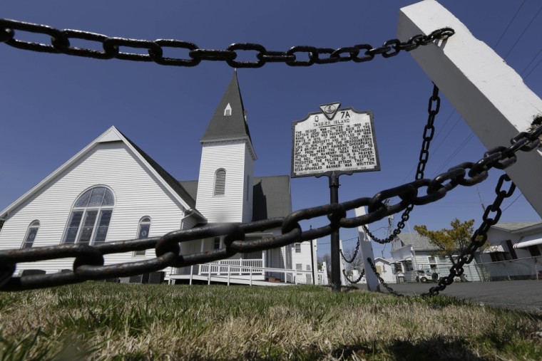 A chain fence surrounds the Swain Memorial Church in Tangier Island, Va., on April 3.