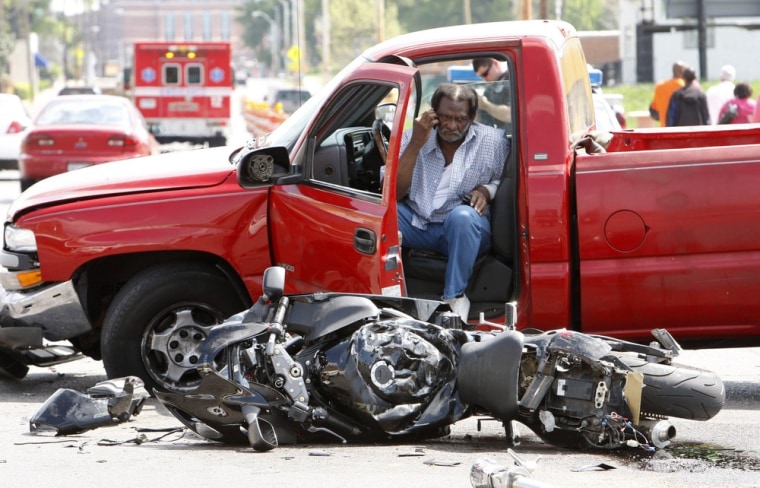 Driver Jimmy Vinson waits for the scene of a motorcycle accident to be cleared on March 26, 2012, in Memphis, Tenn. No one died in this crash, but more than 5,000 riders were killed nationwide last year, according to preliminary accident data.