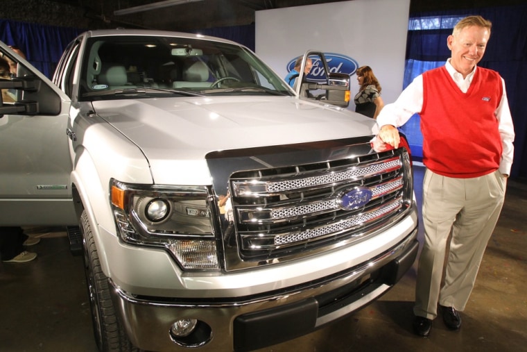 Alan Mulally, President and CEO of the Ford Motor Company, stands next to the 2013 Ford F-150 pickup truck after it was unveiled Monday June 4, 2012 a...