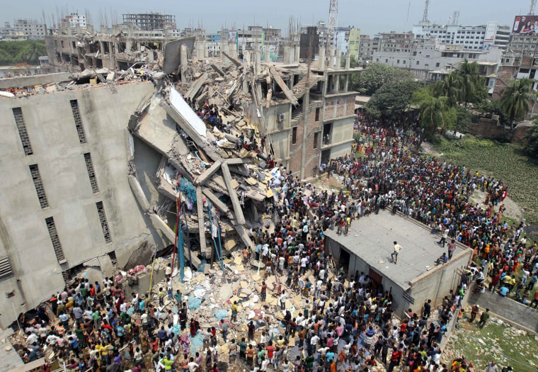 People and rescuers gather after an eight-story building housing several garment factories collapsed in Savar, near Dhaka, Bangladesh, April 24