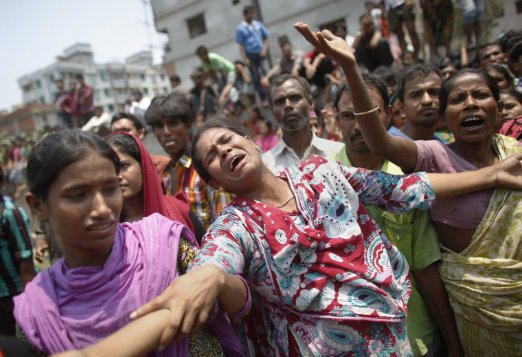 People mourn for their relatives, who were working in the Rana Plaza building when it collapsed, in Savar, Bangladesh, April 24.