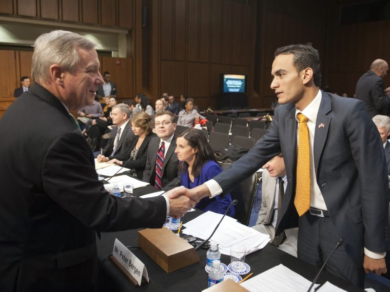 Senate Judiciary subcommittee on the Constitution, Civil Rights, and Human Rights Chairman Dick Durbin, D-Ill., left, shakes hands with witness Farea al-Muslimi of Yemen, at the start of the hearing on drone use on Capitol Hill in Washington, Tuesday, April 23, 2013.