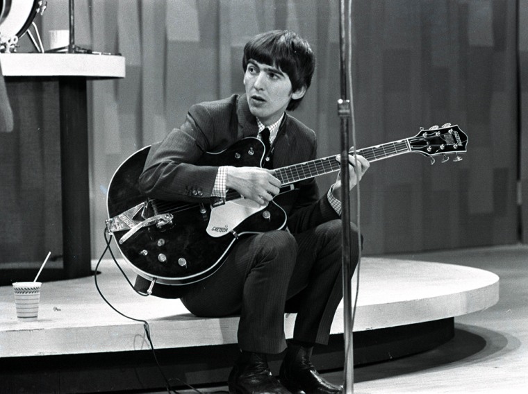 Harrison on stage during The Beatles' 1964 tour of the United States.