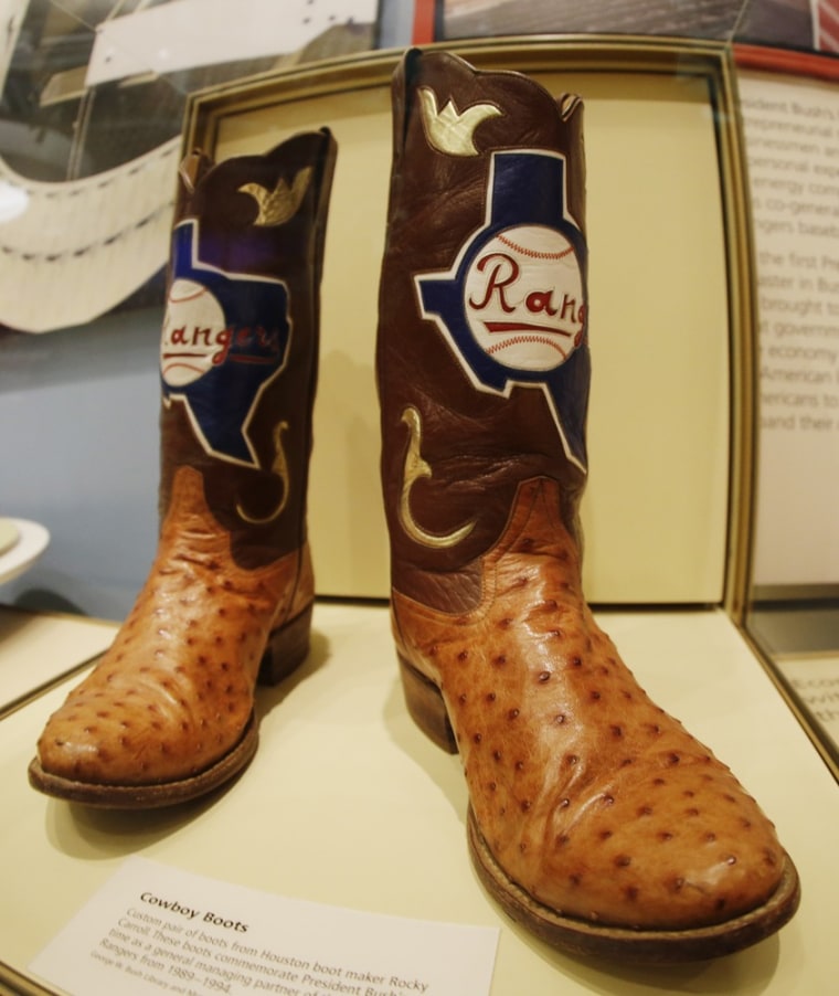 Cowboy boots commemorating the time George W. Bush served as general managing partner for the Texas Rangers, are seen during a tour of the George W. Bush Presidential Center on April 24, 2013