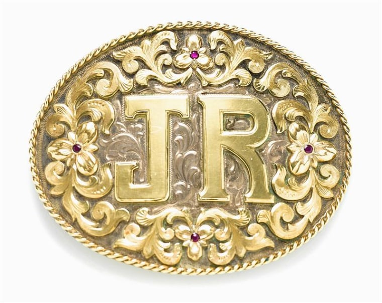 Larry Hagman's ruby-adorned silver and gold belt buckle from \"Dallas.\"